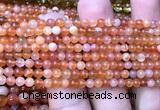 CAA6150 15 inches 4mm round orange Botswana agate beads