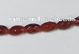 CAA124 15.5 inches 6*10mm faceted rice red agate gemstone beads