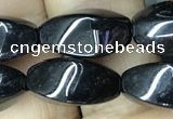 CAA2482 15.5 inches 6*12mm twisted rice black agate beads