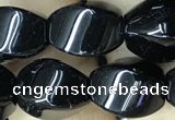 CAA2486 15.5 inches 10*14mm twisted rice black agate beads