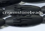 CAA3682 15.5 inches 10*30mm rice matte & carved black agate beads