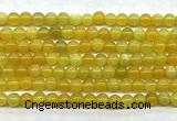 CAA6276 15 inches 4mm round yellow fire agate beads