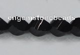 CAB336 15.5 inches 10*14mm faceted & twisted rice black agate beads