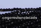 CAG2312 15.5 inches 4mm faceted round black line agate beads