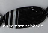 CAG3086 15.5 inches 25*50mm faceted oval black line agate beads
