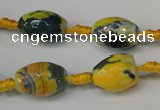 CAG5774 15 inches 10*14mm faceted rice fire crackle agate beads