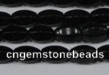 CAG6029 15.5 inches 6*10mm faceted rice matte black agate beads