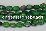 CDE178 15.5 inches 6*8mm oval dyed sea sediment jasper beads