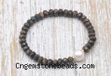 CFB754 faceted rondelle bronzite & potato white freshwater pearl stretchy bracelet