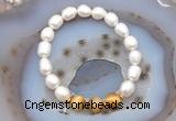 CFB914 9mm - 10mm rice white freshwater pearl & golden tiger eye stretchy bracelet