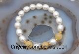 CFB928 9mm - 10mm rice white freshwater pearl & honey jade stretchy bracelet