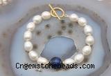 CFB980 Hand-knotted 9mm - 10mm rice white freshwater pearl & blue tiger eye bracelet