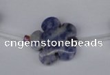 CFG1006 15.5 inches 20mm carved flower blue spot stone beads