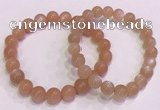 CGB4587 7.5 inches 8mm - 9mm round sunstone beaded bracelets