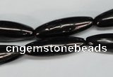 CJB54 15.5 inches 10*30mm rice natural jet gemstone beads