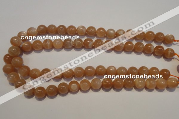 CMS704 15.5 inches 12mm round peach moonstone beads wholesale