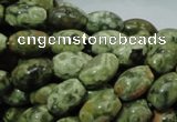 CPS10 15.5 inches 8*12mm rice green peacock stone beads wholesale