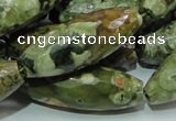 CPS72 15.5 inches 15*40mm faceted rice green peacock stone beads