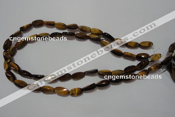 CTE1097 15.5 inches 8*15mm twisted & faceted oval yellow tiger eye beads