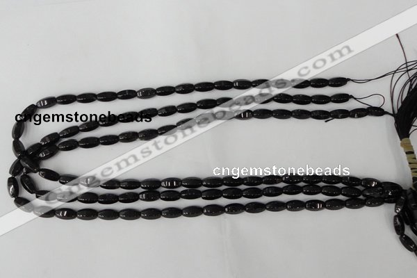 CTO116 15.5 inches 5*10mm faceted rice black tourmaline beads