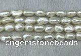 FWP285 15 inches 9mm - 10mm baroque white freshwater pearl strands